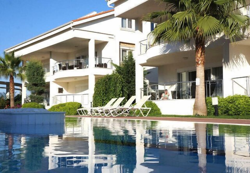 The ground floor home overlooks the pool