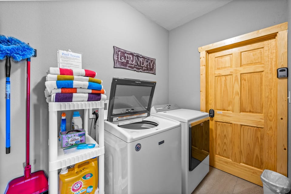 Laundry Room: full-size washer & dryer (w/ laundry supplies) & pool towels.