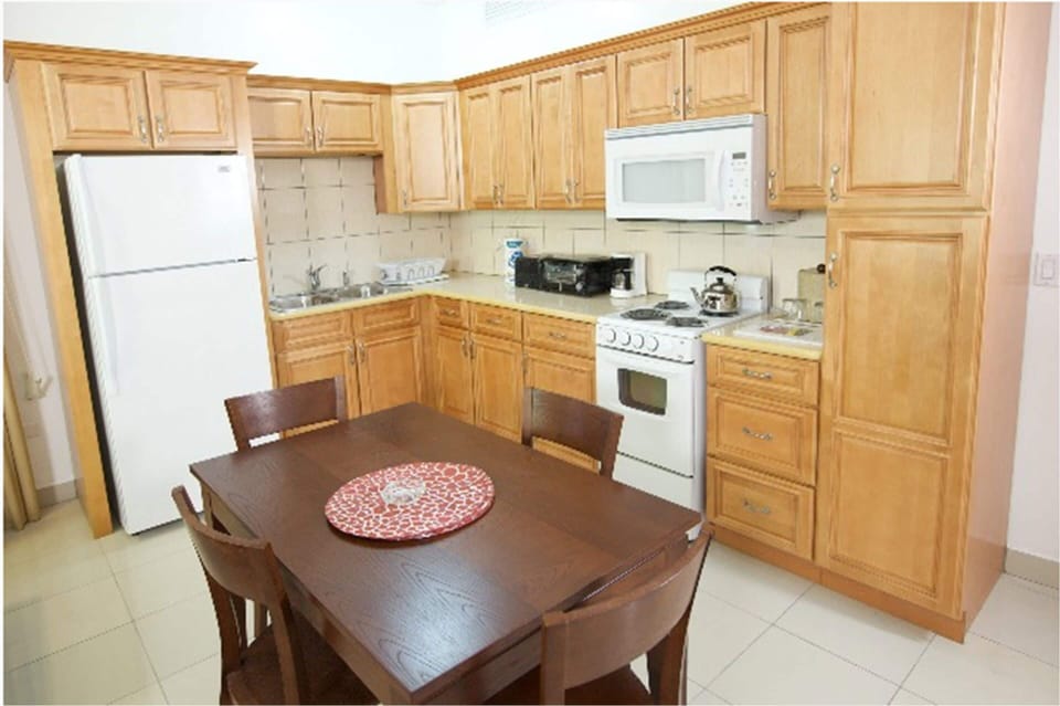 Suite, 1 Bedroom | Private kitchen | Coffee/tea maker, full-size fridge, microwave, stovetop