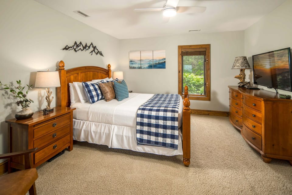 Comfortable upstairs queen bedroom with mountain-inspired décor