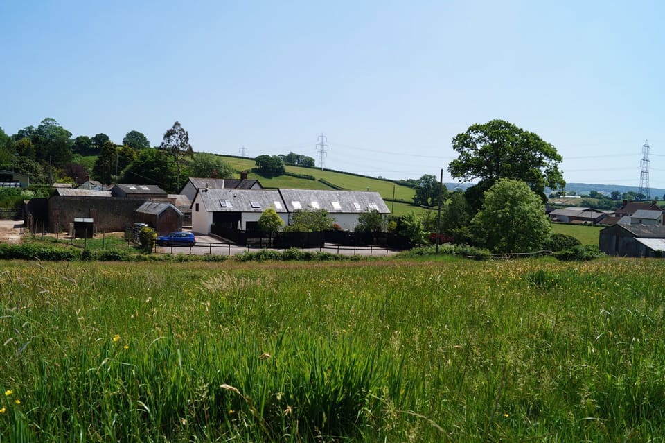Hunters Moon is a semi-detached holiday property (left) adjacent to Harvest Moon (right) on a farm near Feniton