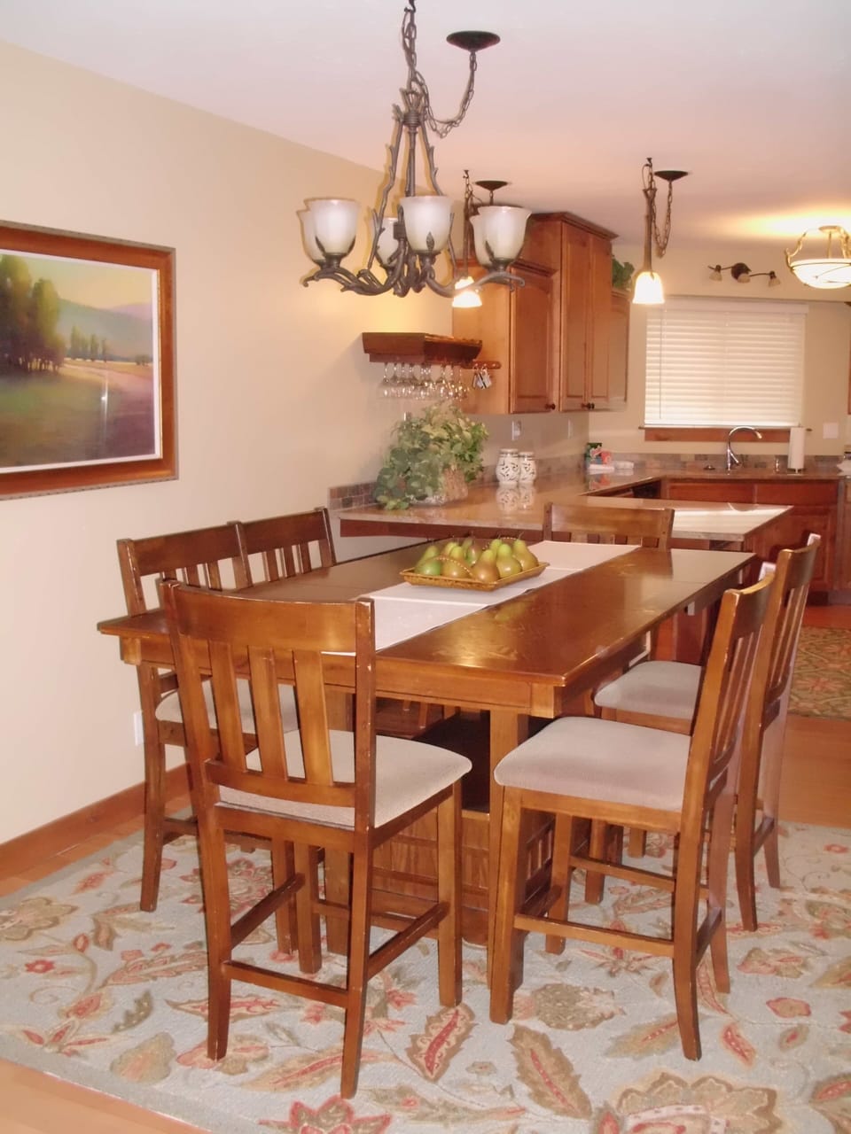 Dining Table with bench seating. Seats 6 to 8. More seating at bar in kitchen.