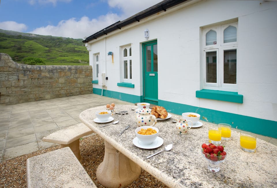 Private enclosed courtyard with garden furniture