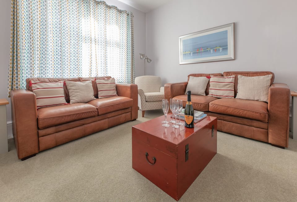 Ground floor: Comfortable sitting room with electric effect wood burning stove (please note, there is now a new sofa)