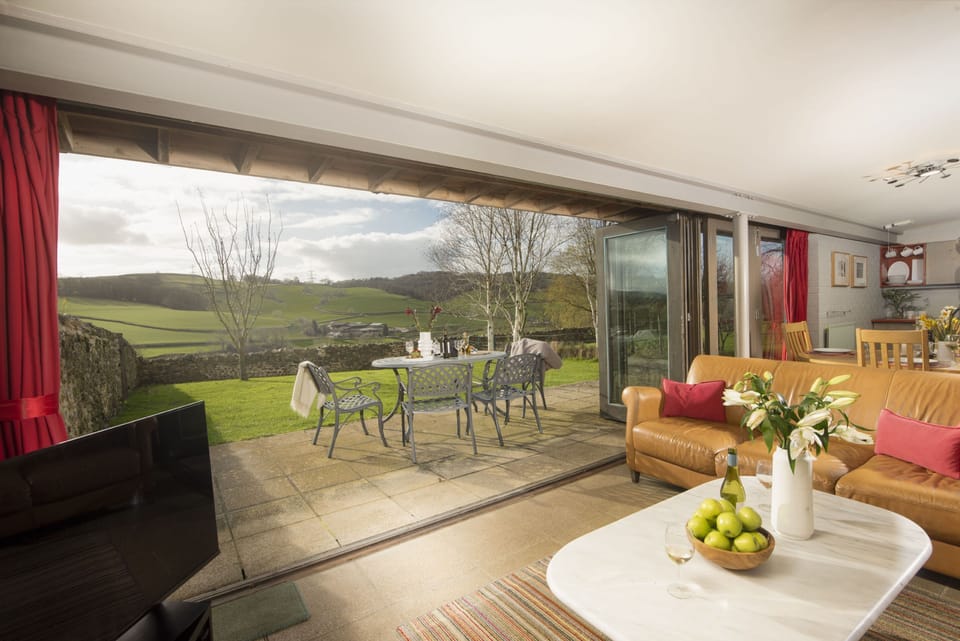 The open-plan sitting, dining and kitchen area has stunning views from all angles