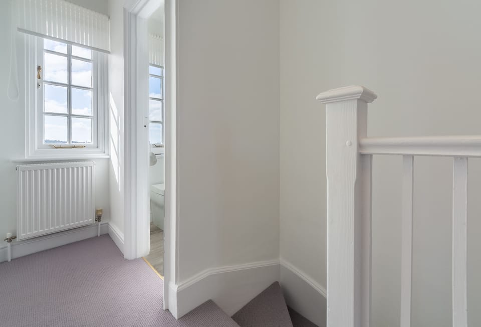 First floor: Landing leading to the three bedrooms and a cloakroom/WC