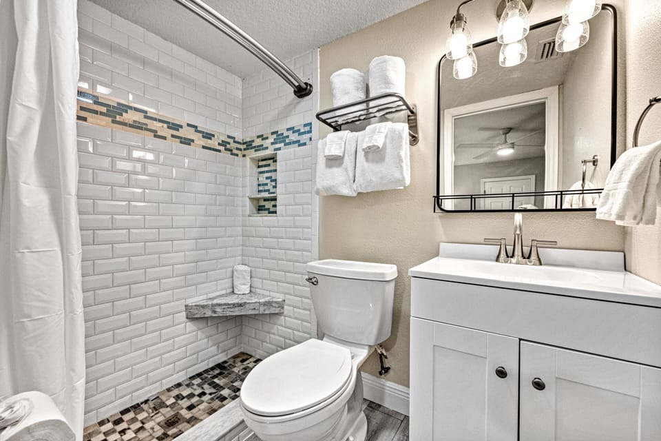 Bright and modern, the ensuite features a walk-in shower and clean finishes for ease and style.