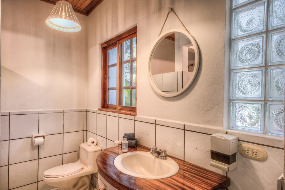 Deluxe Room, Multiple Beds, Garden View (Ground Floor) | Bathroom | Shower, hair dryer, towels, soap
