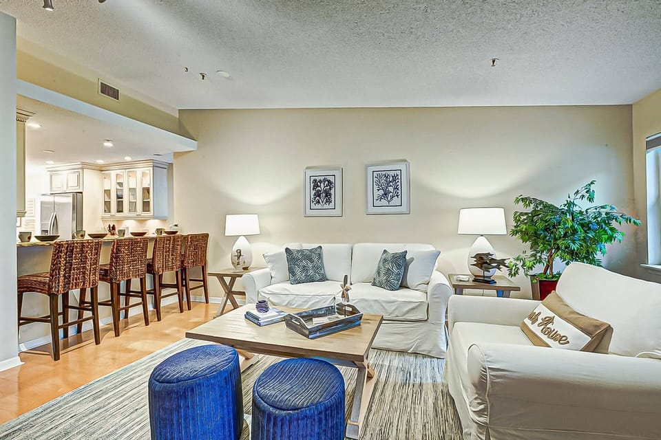 Living room is open, light and bright.  Enjoy breakfast at the breakfast bar or out on the lanai....