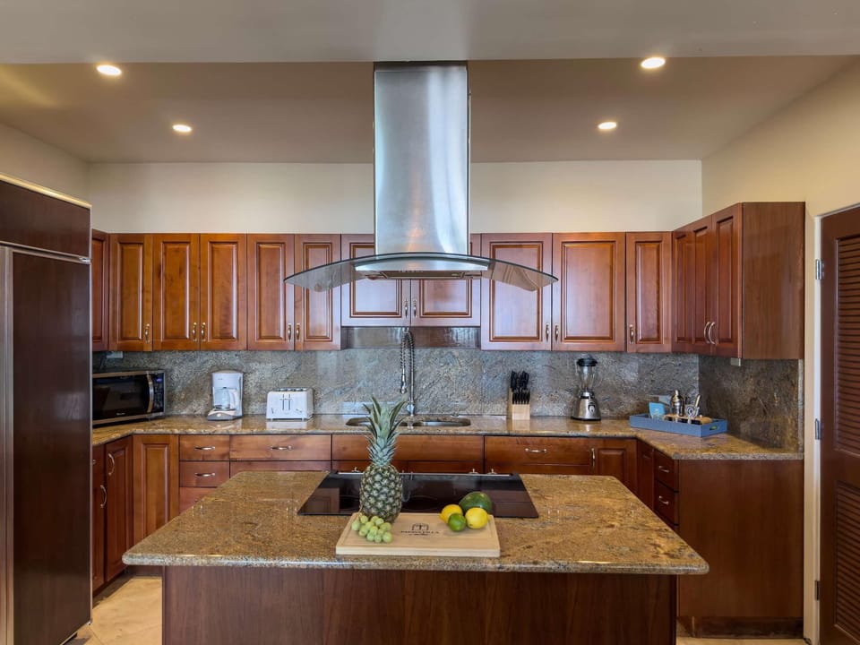 Spacious kitchen with granite island and modern appliances