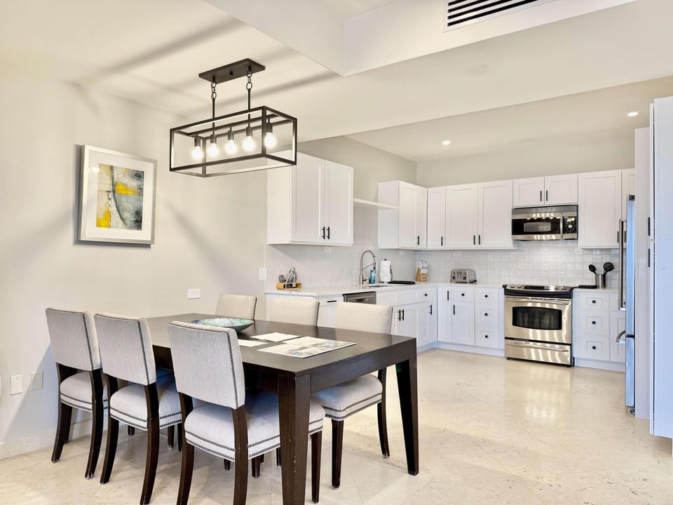 Bright, modern kitchen and dining area with sleek design