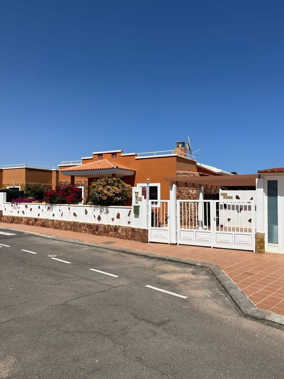 Front view, gates to private parking