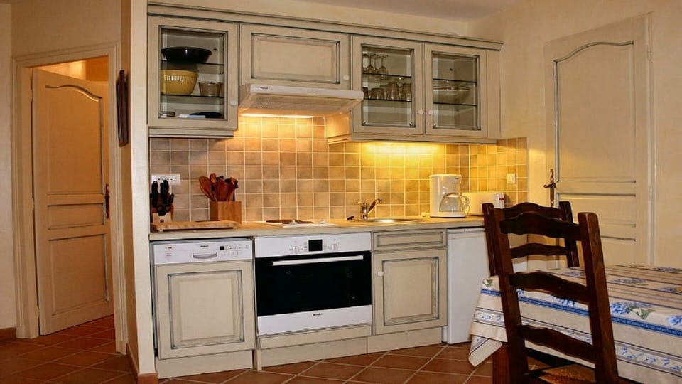 Studio Kitchen and Door to Bath and Laundry