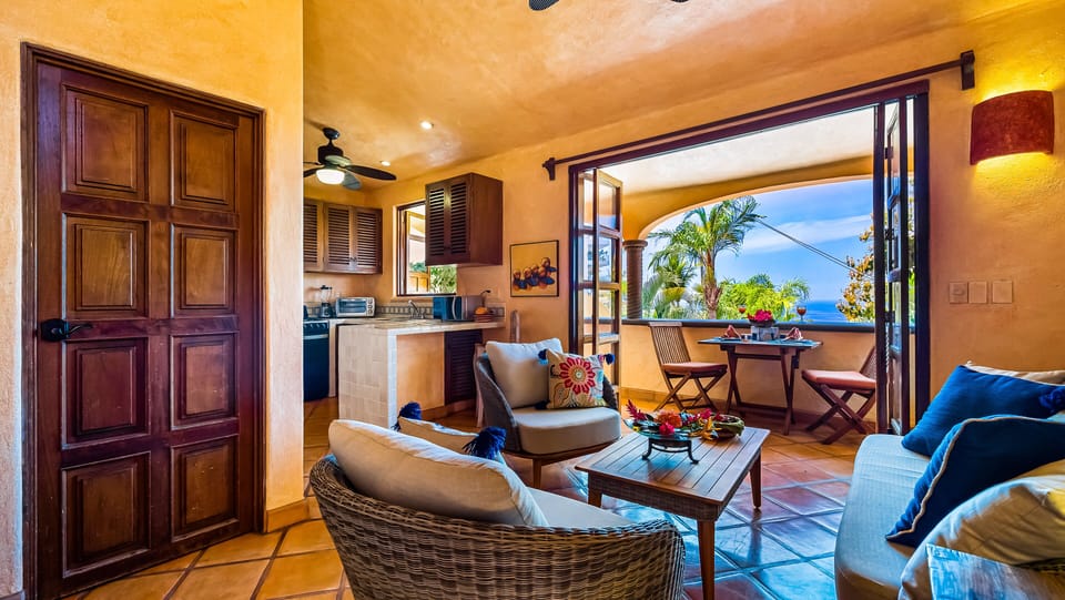 Open concept living room to the kitchen and balcony.