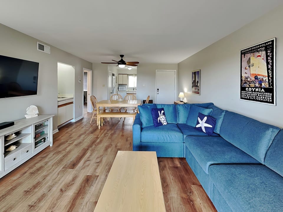 Open Living & Dining w. Smart TV + Balcony Access