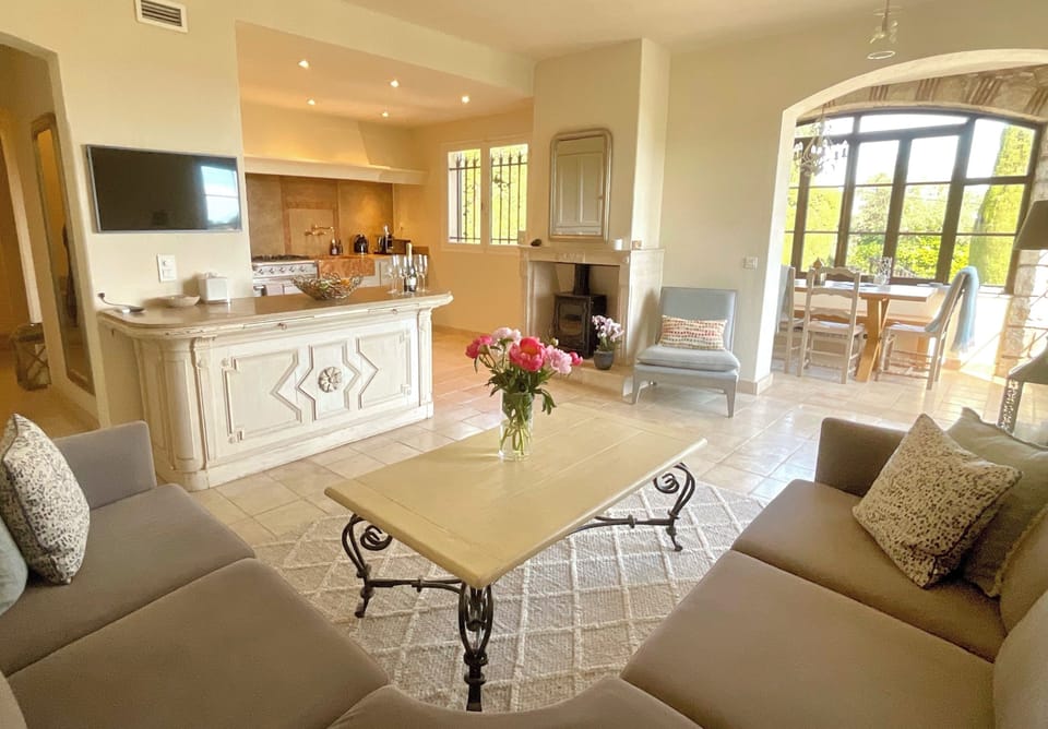 The open plan living room and kitchen, into the dining room