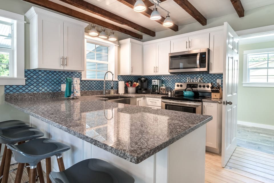 Beautiful granite countertop allows ample space for meal prep