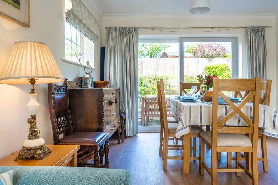 Ground floor: Dining area with patio doors into the garden