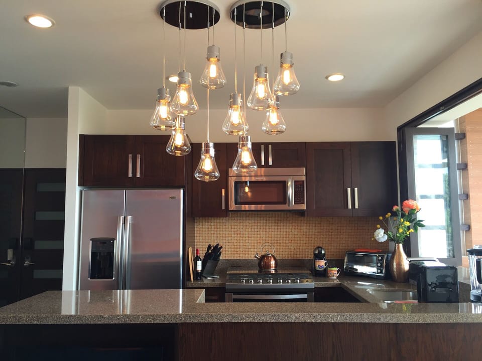 well equipped kitchen with 6 burner gas stove & pass through to terrace