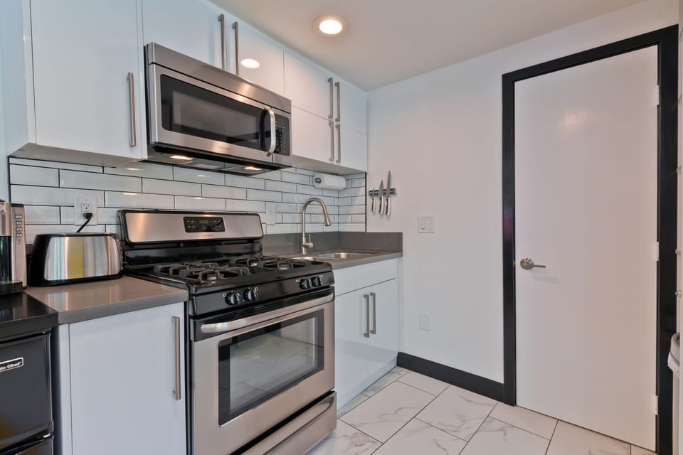 Studio kitchen. 2 mini fridges, garbage disposal, full gas range 