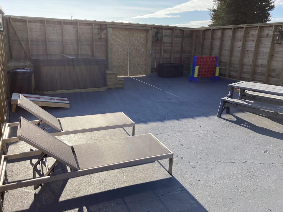 Party patio, with hot tub.