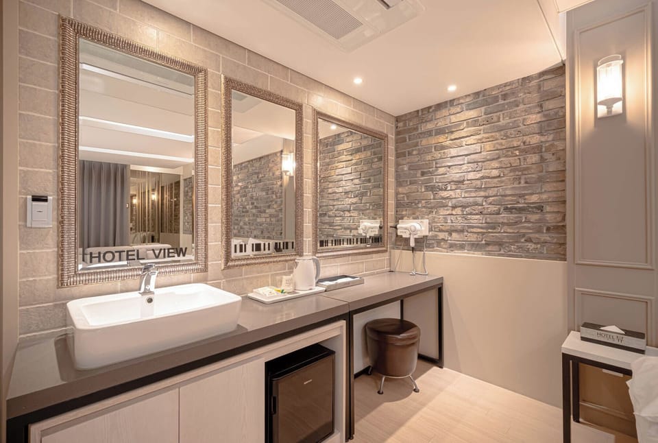 Shower, designer toiletries, hair dryer, bathrobes