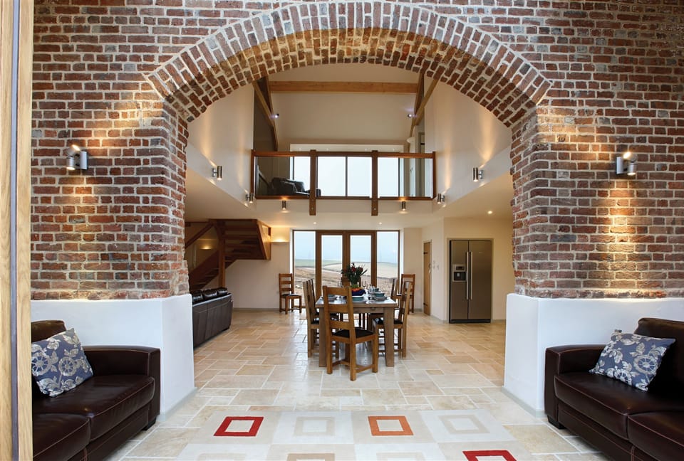 Ground floor:  Original 15' high brick arch