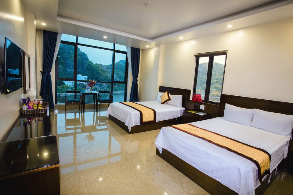 Deluxe Quadruple Room | Minibar, desk, blackout drapes, soundproofing