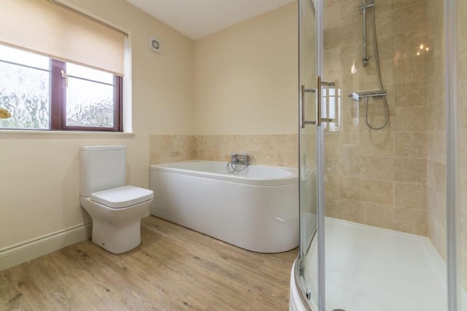 First floor: Family bathroom with separate shower
