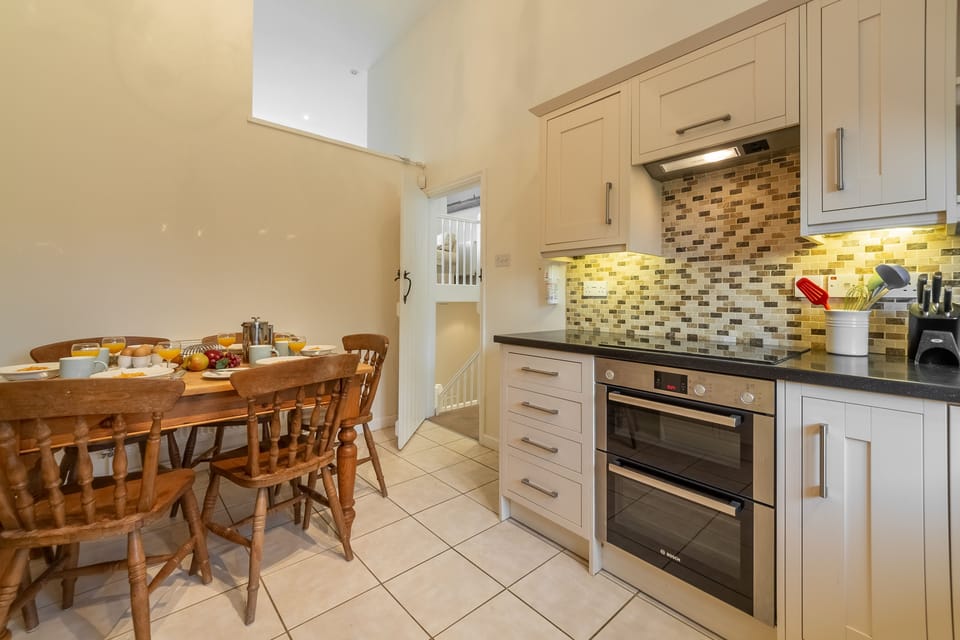 Lower First Floor: Well equipped kitchen with seating for six