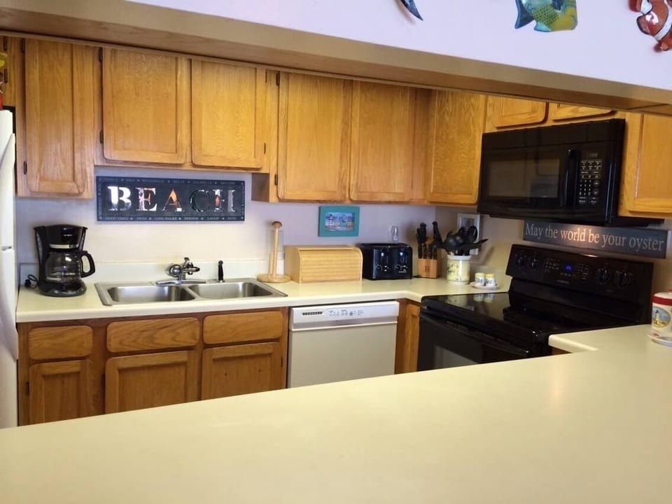 Adjacent to the dining area is the beautifully decorated kitchen for your culinary skills.