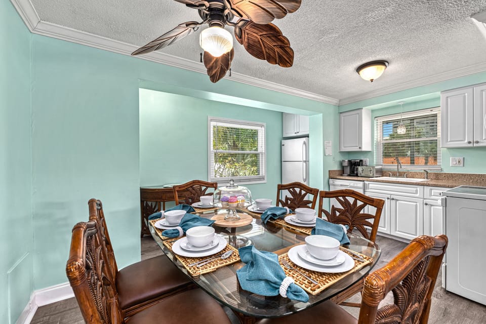 The dining table for six sits just off the kitchen, perfect for sharing meals and staying connected while cooking.
