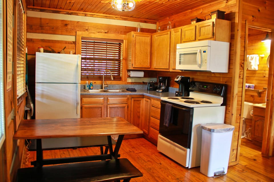 Kitchen complete with dishes, cookware, and appliances.  Just bring the food!