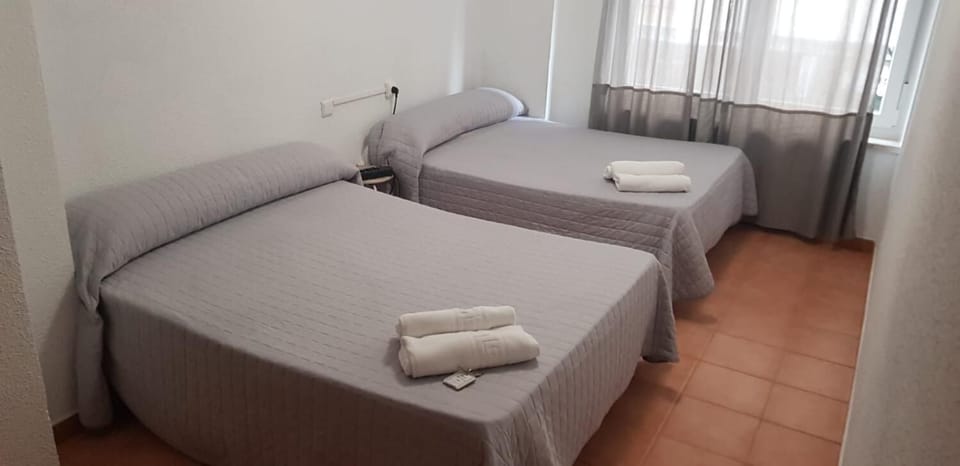 Blackout drapes, free WiFi, bed sheets