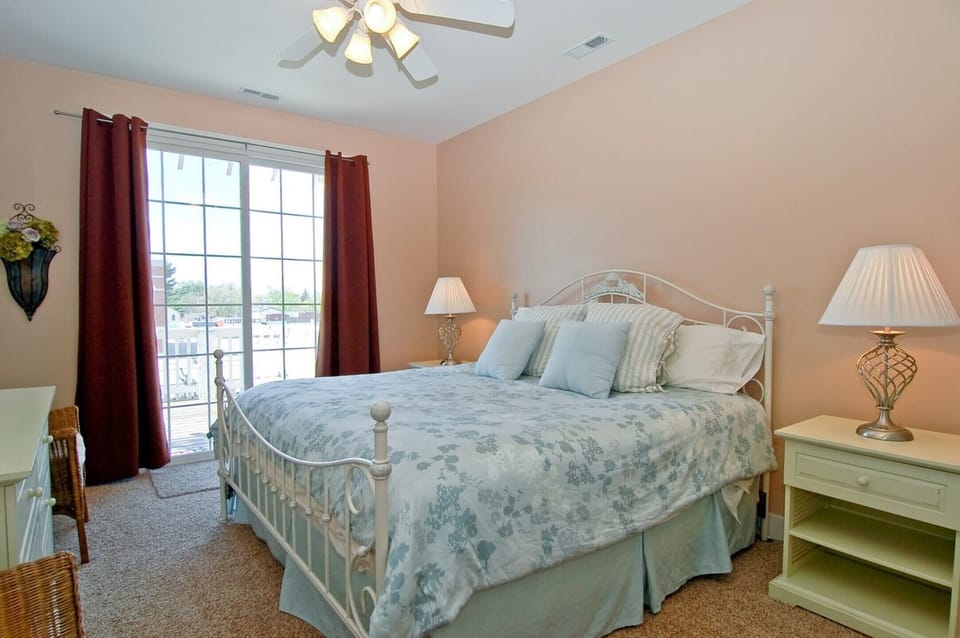 Master bedroom with King and outdoor deck. 