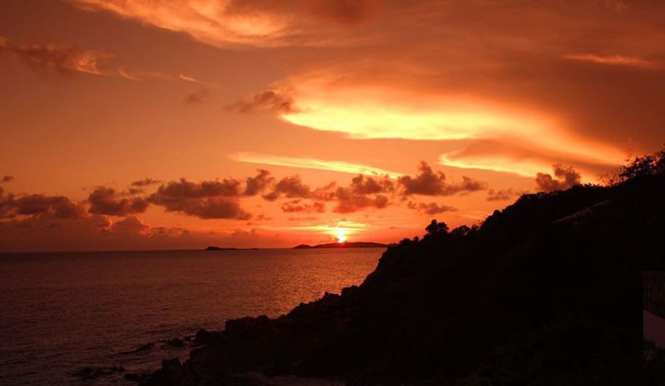 In the winter months the sun falls with a blaze of color into the Caribbean Sea