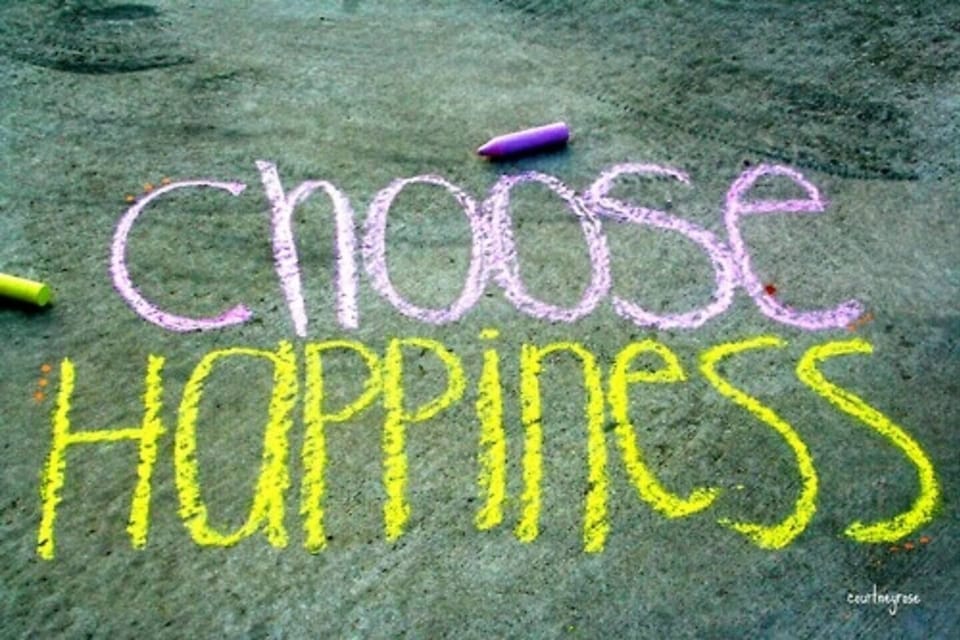 “Choose Happiness” message written in colorful chalk for a playful, uplifting vibe
