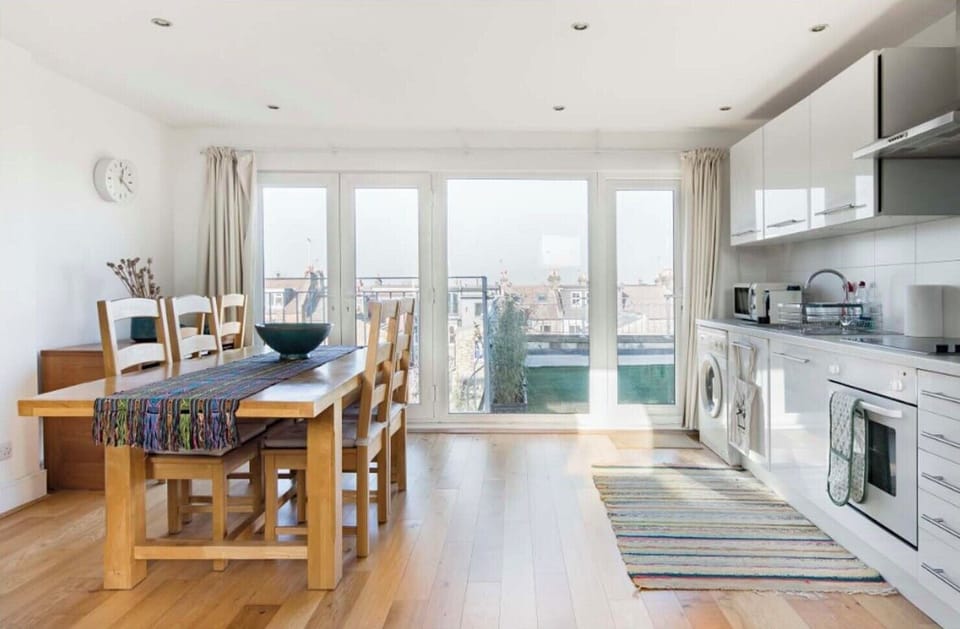 Loft area with view, open plan kitchen, dining area and living room