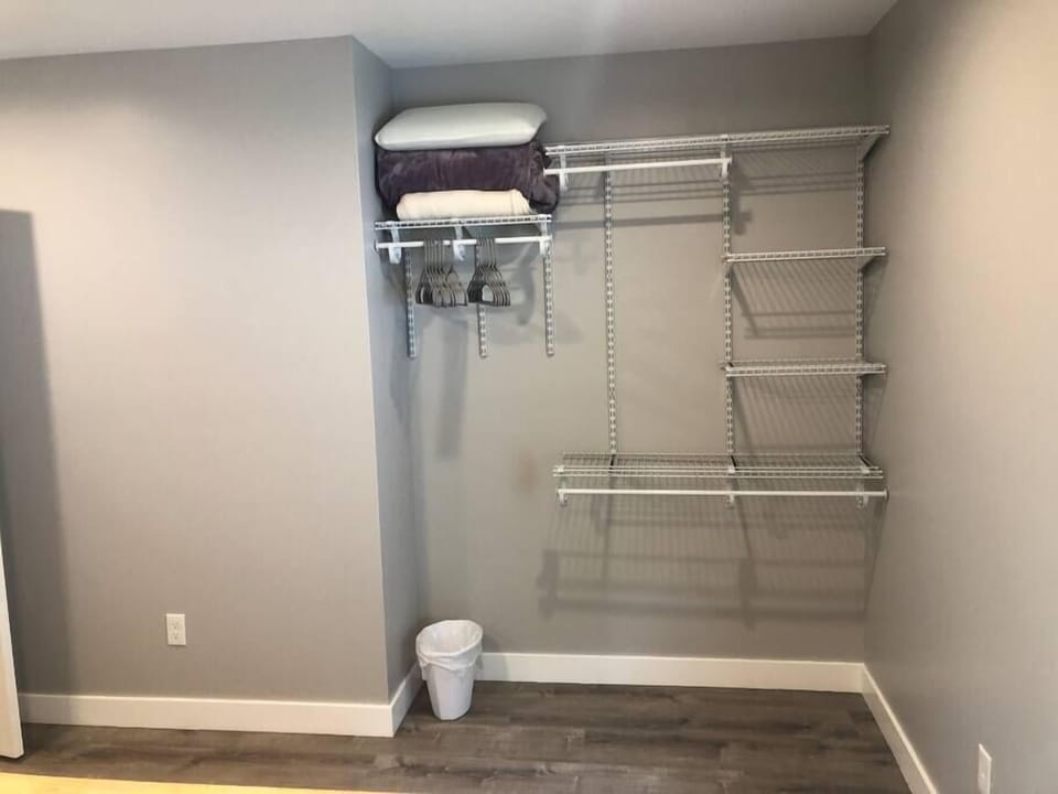 Queen bedroom with clothing/closet storage space