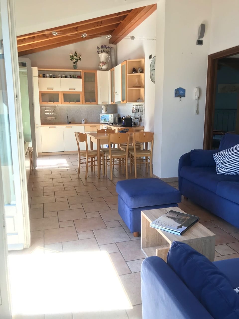 Open plan living and kitchen with lake view.