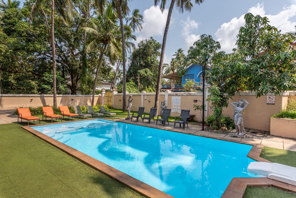 3 BHK villa with swimming pool and sunbeds