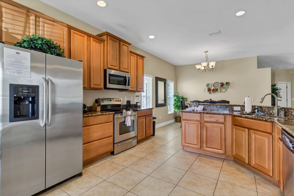 Gourmet kitchen with stainless steel appliances puts you in the mood to cook 