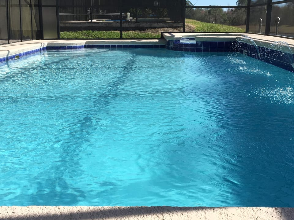 The jumbo pool\spa has just been resurfaced emanating sparkling turquoise water.