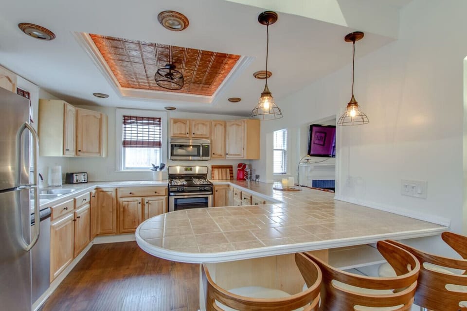 A spacious kitchen with wrap-around counter space gives everyone room to help out.