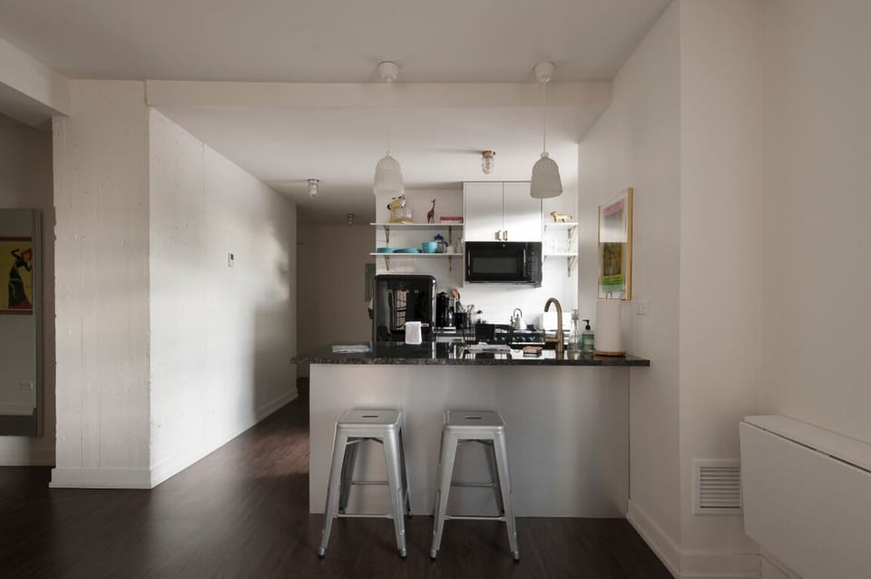 Fully stocked kitchen with bar seating