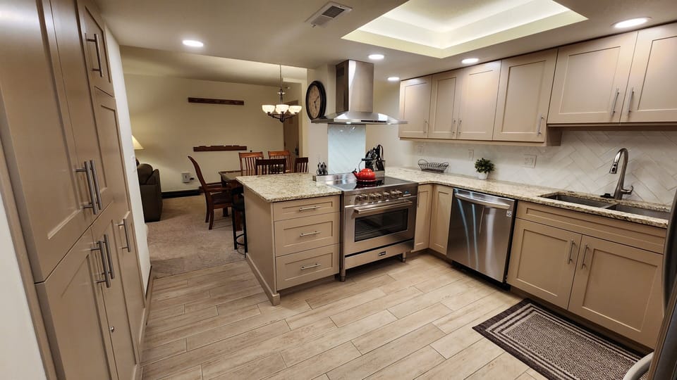 Kitchen:  Stainless appliances, granite counter-tops, fully stocked kitchen ware