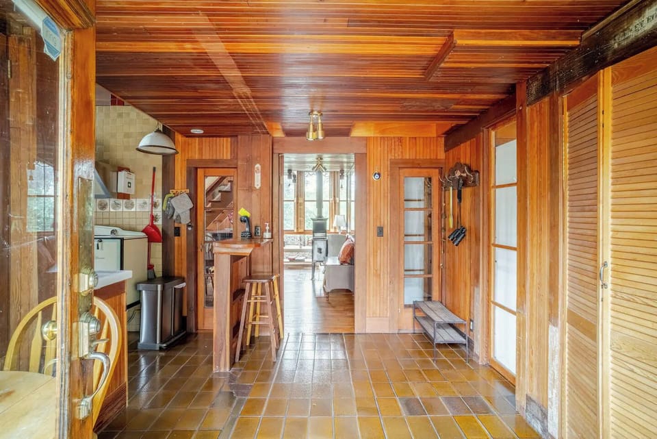 View from entranceway to kitchen on left, downstairs bathroom on right