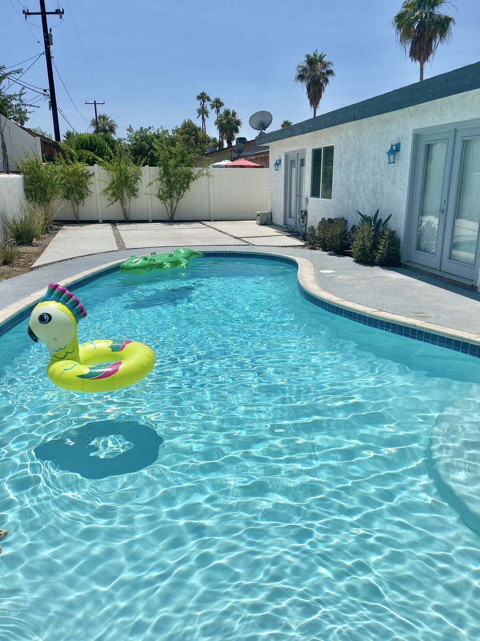 The pool is accessible via the kitchen, dining room, and master suite