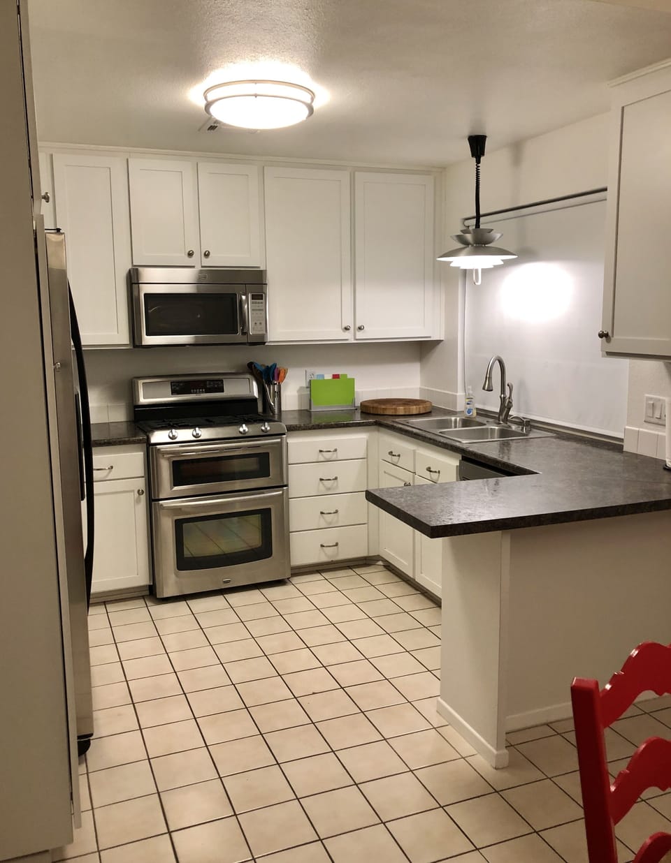 Stainless steel appliances in a fully stocked kitchen feel like home