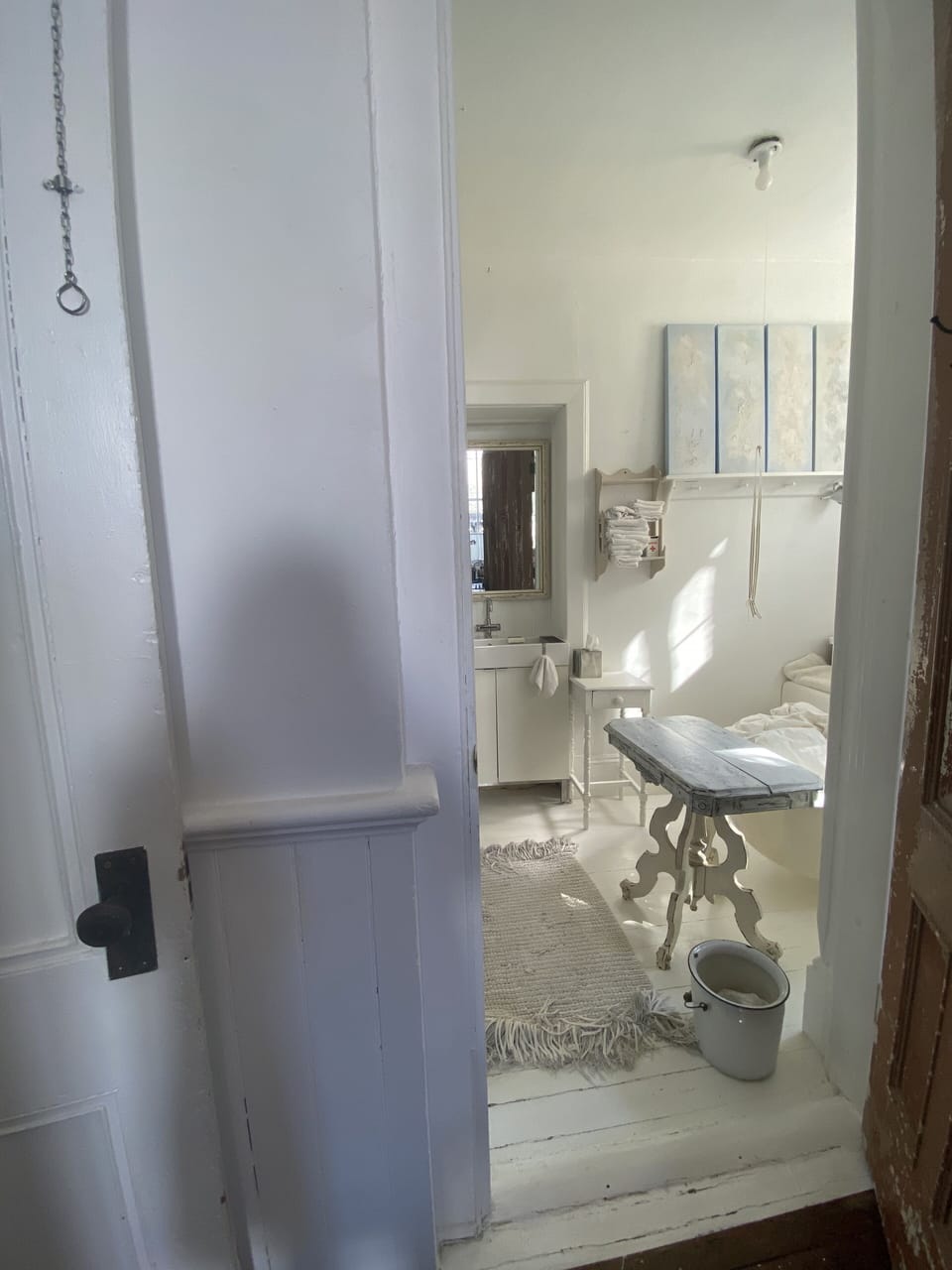 Entry from the Great Hall to bathroom number 5 with a giant clawfoot tub
